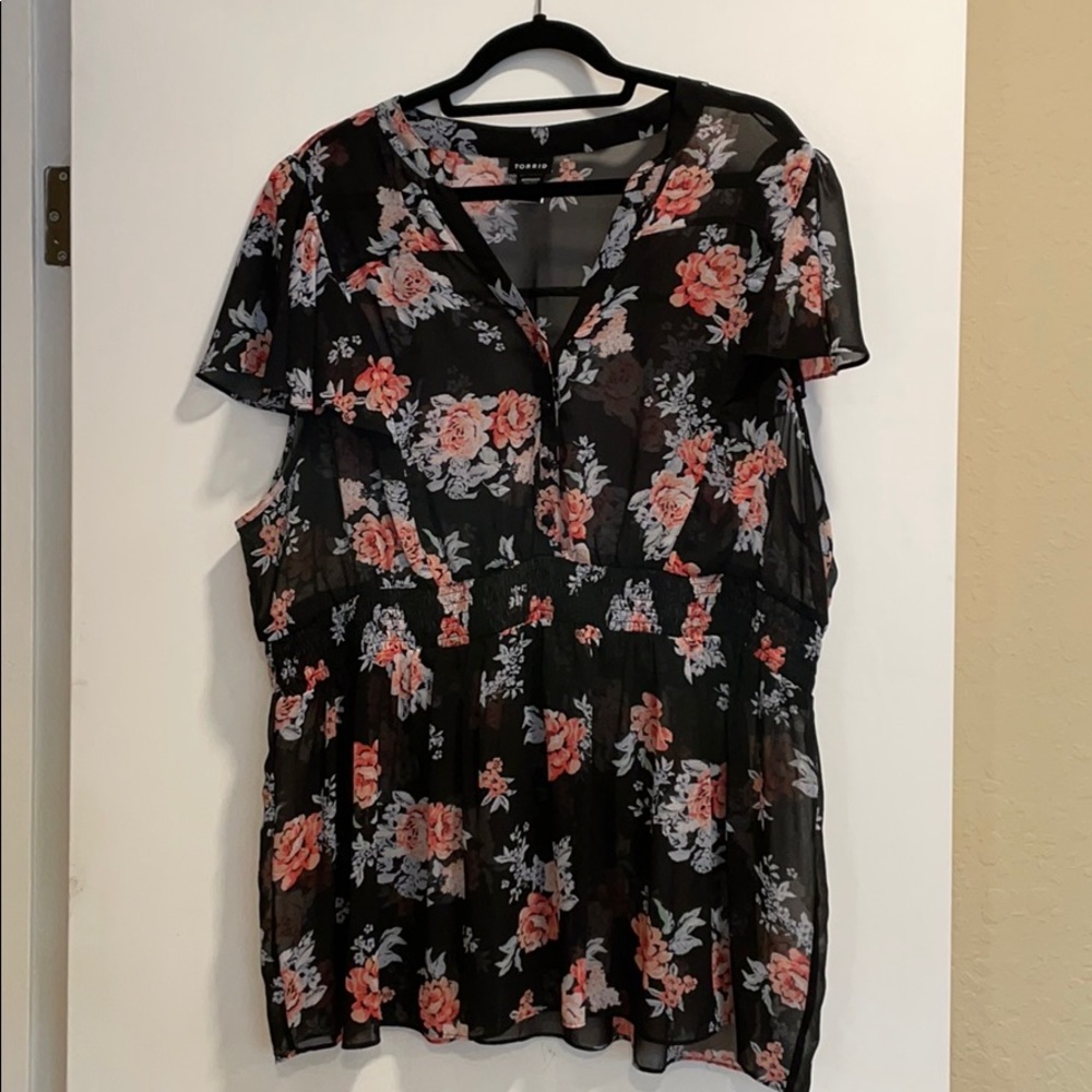 Torrid sheer top. Black floral empire waist